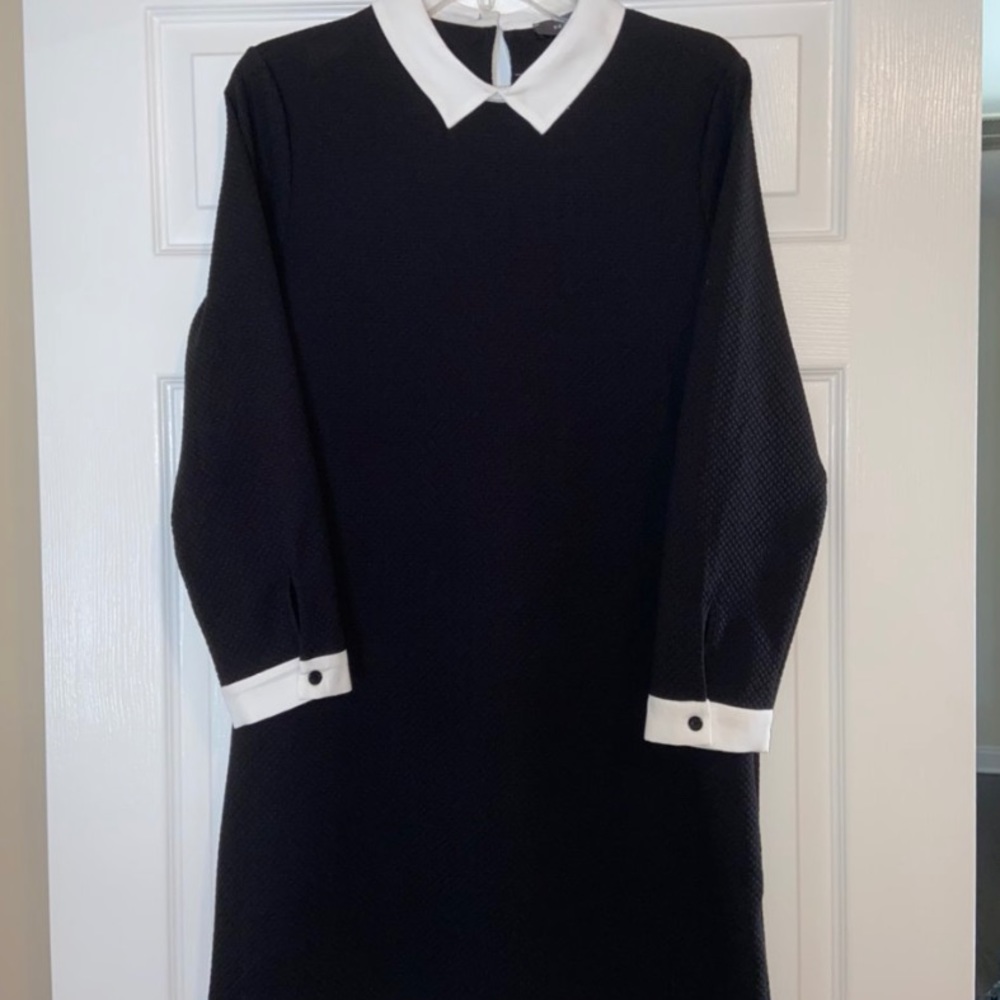 Black dress worn white collar and cuffs